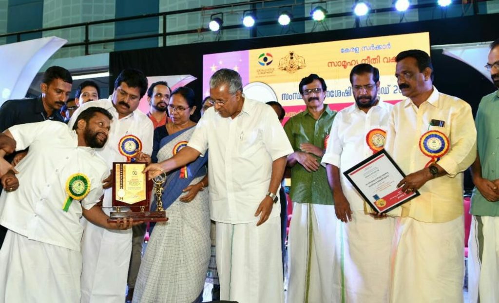 Receiving award from pchief minister of kerala
